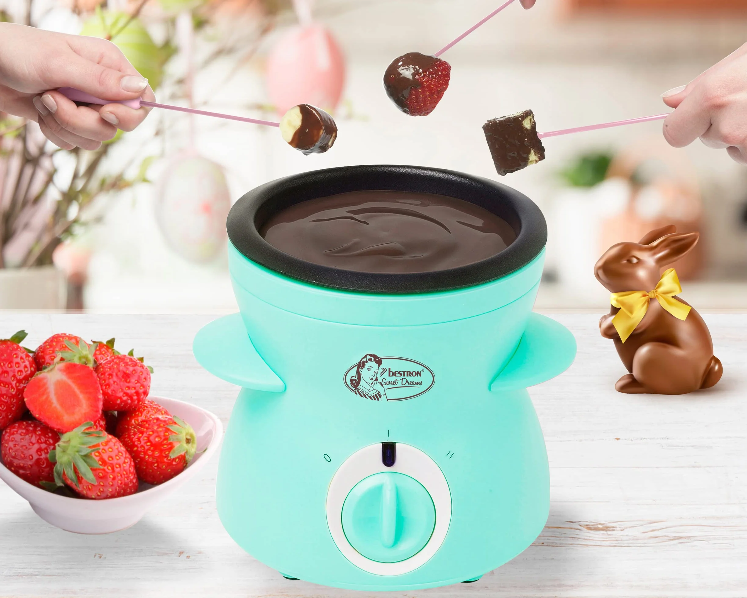 Bestron Czekoladowe fondue dla 2 osób, mini zestaw do fondue czekoladowego, w zestawie: 10 szpikulców, 10 widelców i 1 x szpachelka, 25 W, kolor: miętowy